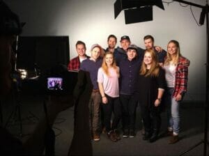 Group photo in a studio setting.