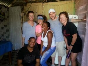 Group of people smiling indoors.