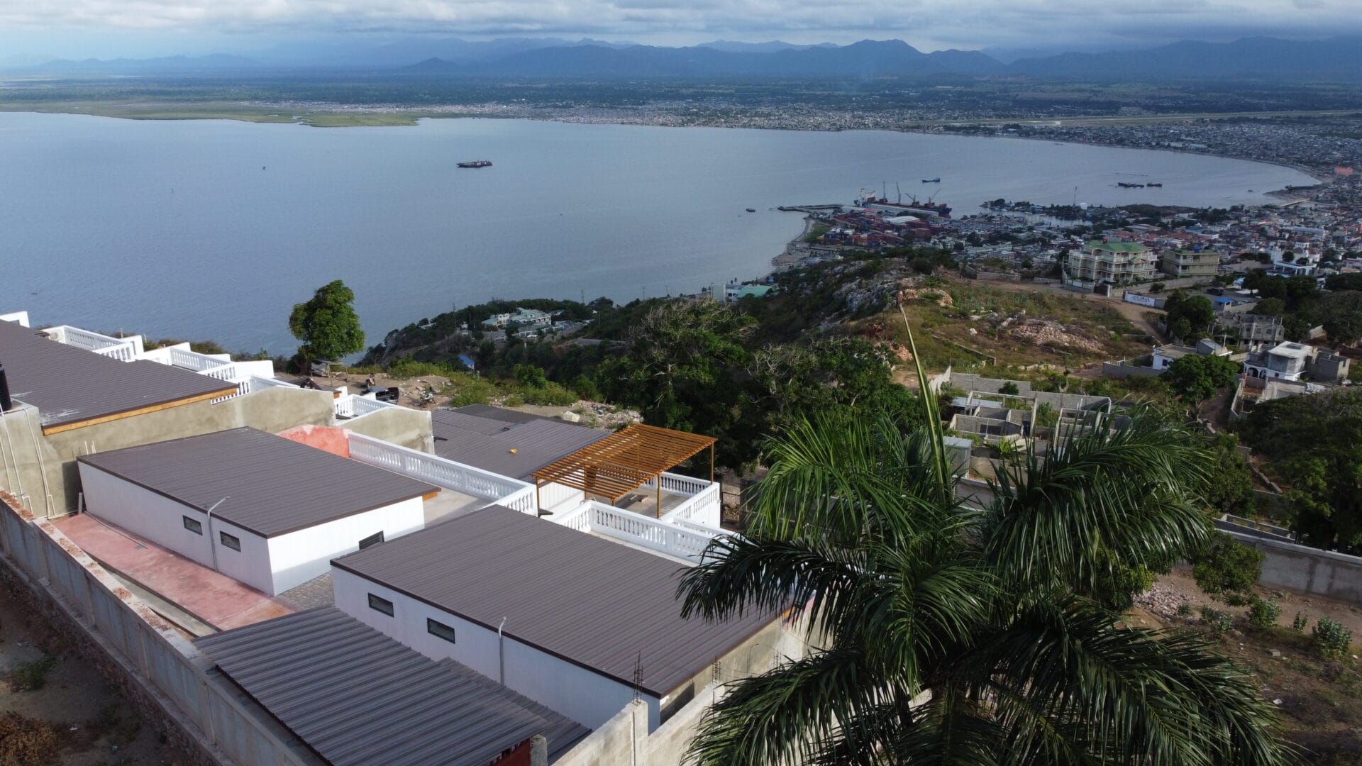 Aerial view of coastal city and waterfront homes.