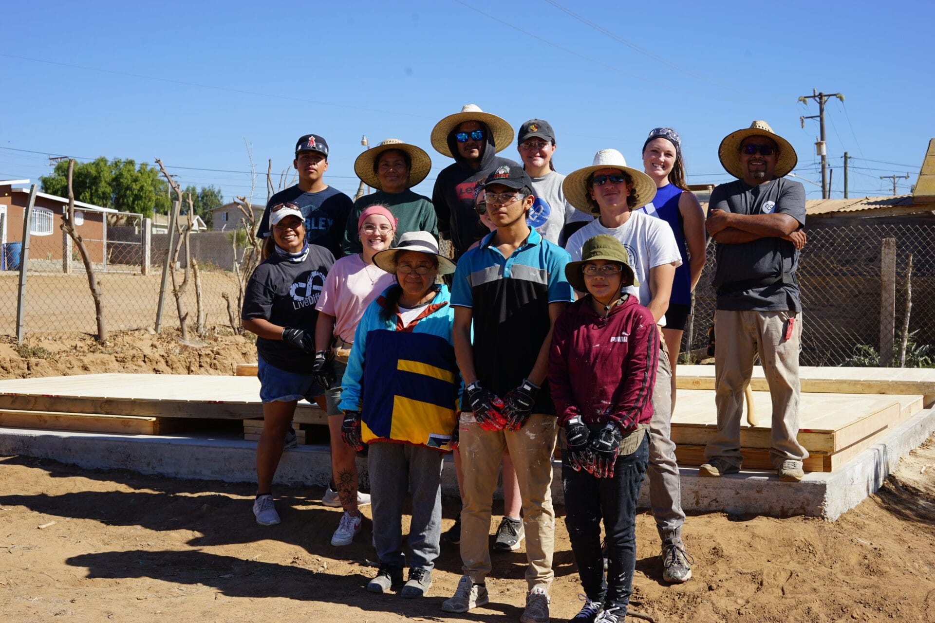 Group building a house foundation outdoors